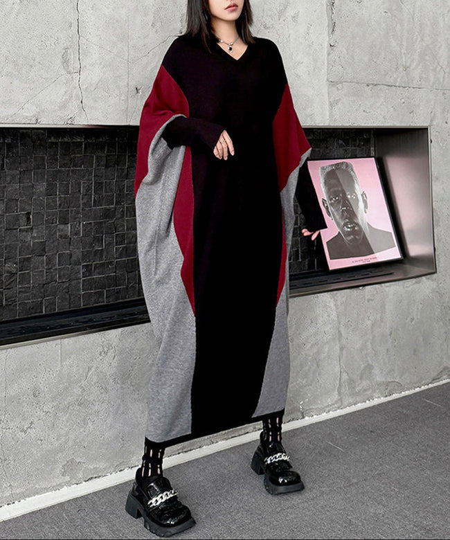 White FJØRNA panel knit long dress displayed on a model, featuring a fitted silhouette and elegant length.
