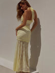 Elegant lace women's maxi dress by FJØRNA, showcasing intricate lace details and flowing fabric ideal for evening or formal occasions.