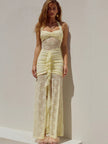 FJØRNA lace women's maxi dress for evening and formal wear, featuring intricate lace details and a flowing silhouette.