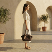 FJØRNA vegan leather medium work tote bag with waterproof design, featuring sturdy handles and spacious interior for daily use.