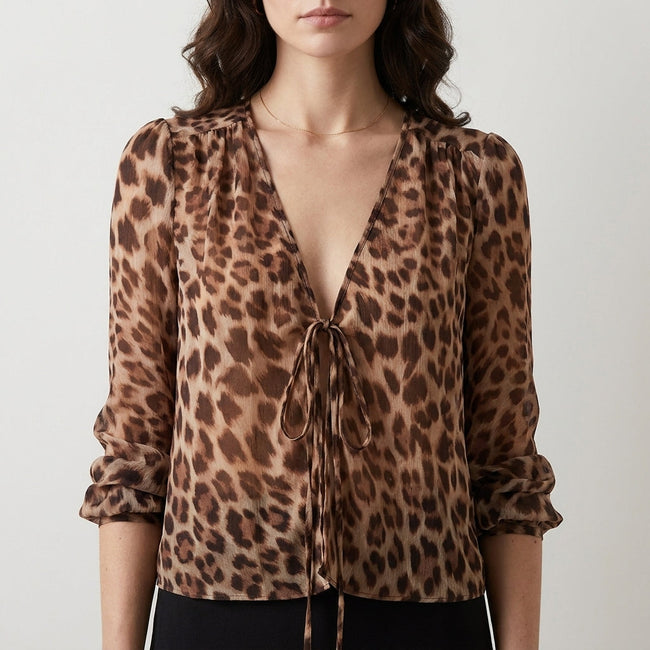 FJØRNA women's summer blouse with V-neck and long sleeves, denim fabric, featuring a leopard print pattern.