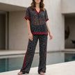 Elegant two-piece women's chiffon leopard co-ord set by FJØRNA, featuring a stylish top and matching skirt with leopard print pattern.
