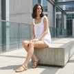 FJØRNA women's summer two-piece ruffle co-ord set, stylish and comfortable for warm weather, shown styled in a casual outdoor setting.