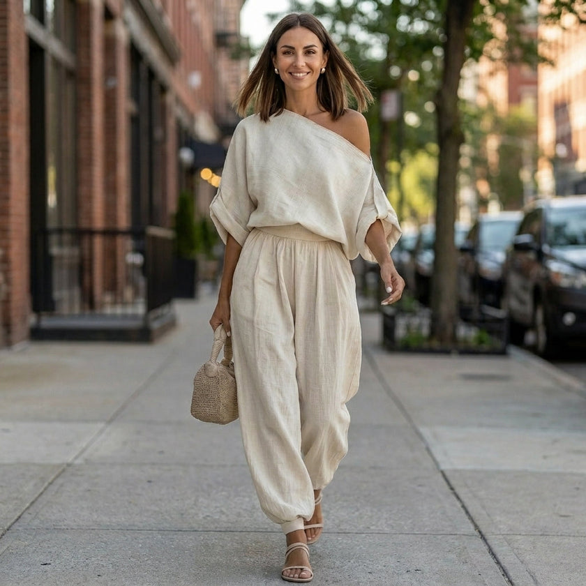 FJØRNA women's two-piece co-ord set with one-shoulder design and pockets, styled in a casual lifestyle setting.
