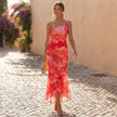 FJØRNA elegant one-shoulder maxi dress for women, fitted bodycon style, worn by a woman in a stylish outdoor setting