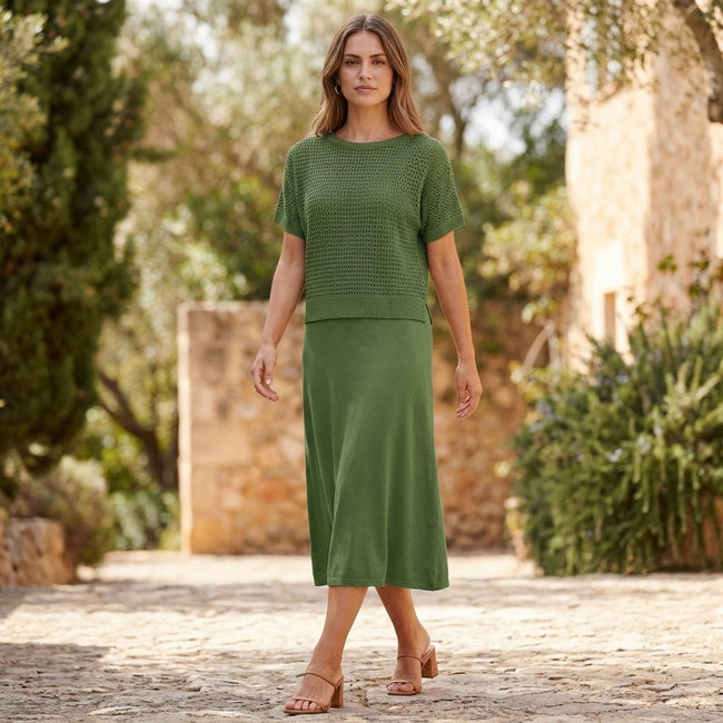 FJØRNA elegant two-piece women's knit cropped co-ord set worn casually outdoors with a relaxed fit and stylish design.