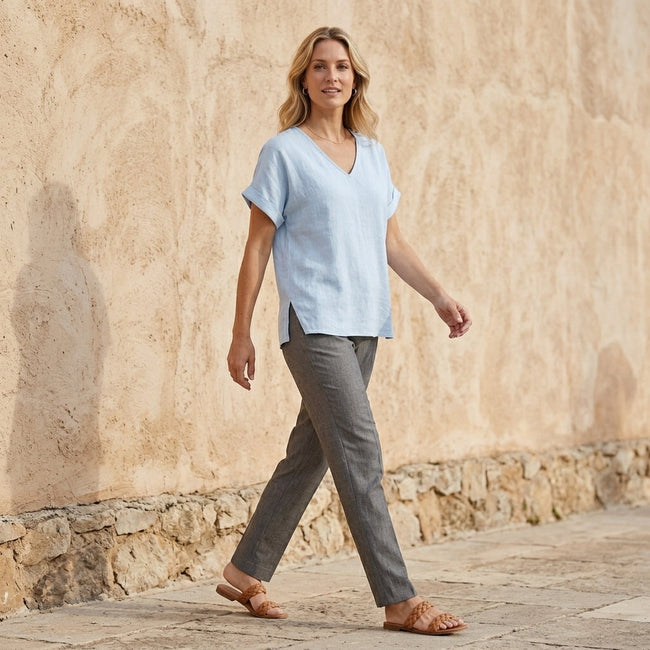 FJØRNA women's summer V-neck denim blouse with short sleeves, styled in a casual outdoor setting.