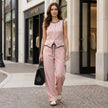 FJØRNA women's summer two-piece co-ord set with button front top and matching shorts, styled in a casual outdoor setting.