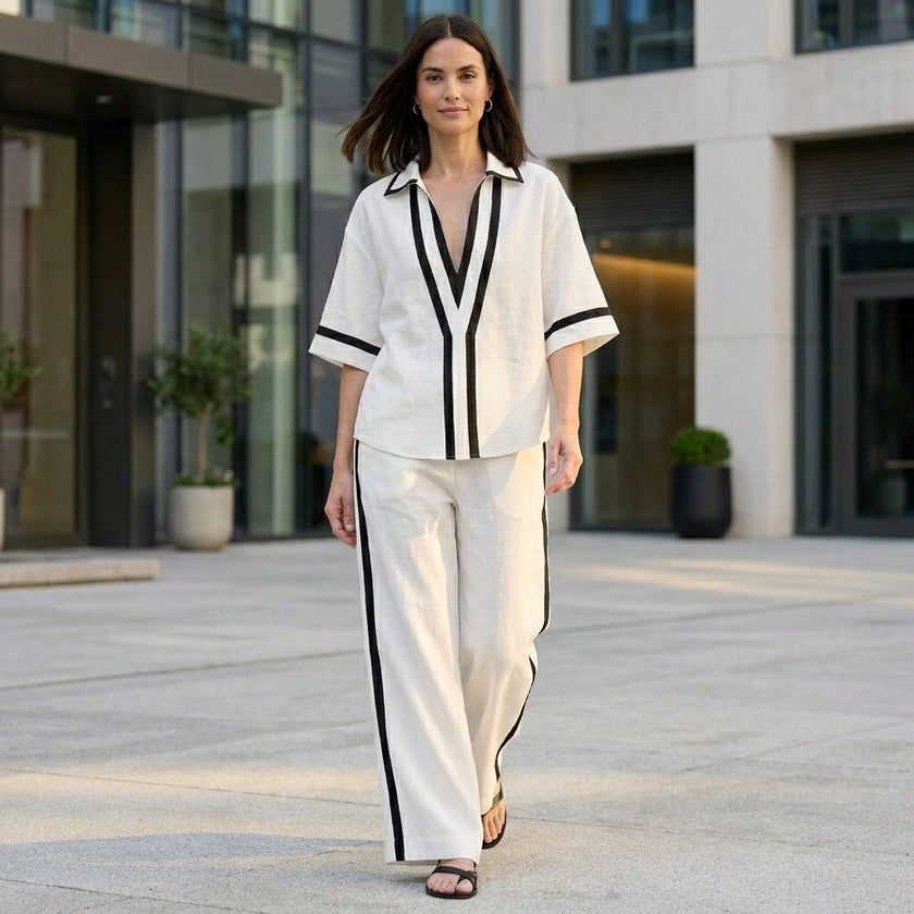 FJØRNA women's elegant two-piece wide-leg V-neck co-ord set styled on a woman in a casual outdoor setting.