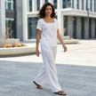 FJØRNA women's summer two-piece co-ord set with wide-leg relaxed fit, styled in a casual outdoor lifestyle setting.