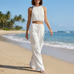 FJØRNA women's summer two-piece co-ord set with halter neck and pockets, shown in a stylish lifestyle setting.