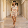 FJØRNA women's summer two-piece striped co-ord set with pockets and V-neck, styled casually in a lifestyle setting.