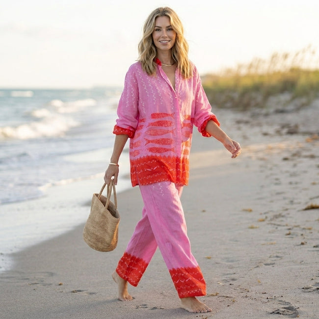 FJØRNA women's summer two-piece co-ord set with geometric pockets and V-neck, styled in a casual outdoor setting.