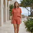 FJØRNA elegant two-piece women's co-ord set featuring a button-front top and matching lightweight bottoms, styled casually.