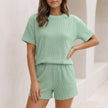 Light green FJØRNA women's two-piece knit co-ord set with pockets, featuring a stylish and comfortable matching top and pants.