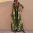 Light green elegant maxi dress for women with geometric V-neck, by FJØRNA, showcasing a flowing design and stylish silhouette.
