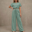 Light green women's summer two-piece co-ord set by FJØRNA with drawstring details and lightweight fabric, perfect for warm weather.
