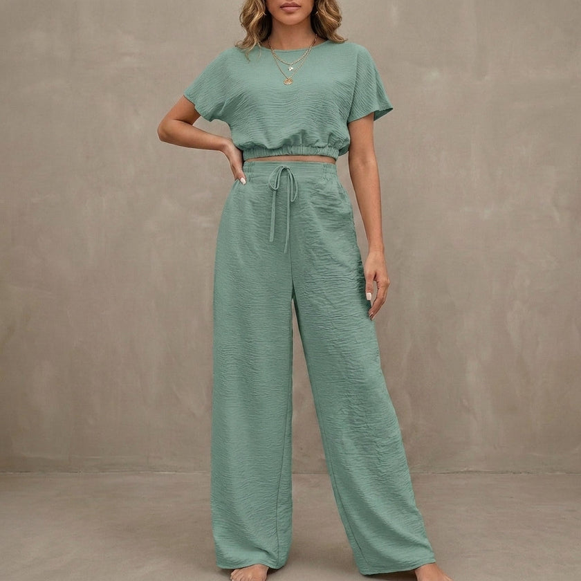 Light green women's summer two-piece co-ord set by FJØRNA with drawstring details and lightweight fabric, perfect for warm weather.