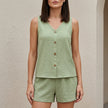 Light green FJØRNA women's summer two-piece co-ord set with button front V-neck top and matching shorts.