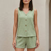 Light green FJØRNA women's summer two-piece co-ord set with button front V-neck top and matching shorts.
