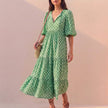 Light green FJØRNA elegant maxi dress for women with V-neck and puff sleeves, flowing and stylish for any occasion.