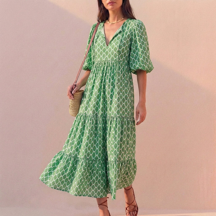 Light green FJØRNA elegant maxi dress for women with V-neck and puff sleeves, flowing and stylish for any occasion.