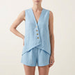 Light blue women's two-piece co-ord set by FJØRNA featuring a button-front design and V-neck top.