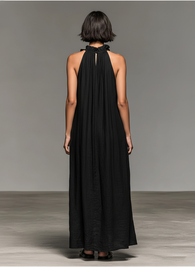 Linen ruffle maxi dress for women by FJØRNA, featuring a flowy silhouette, ruffled neckline, and lightweight linen fabric.