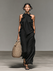 FJØRNA linen ruffle maxi dress for women featuring a flowing design, lightweight fabric, and ruffled details on the skirt.