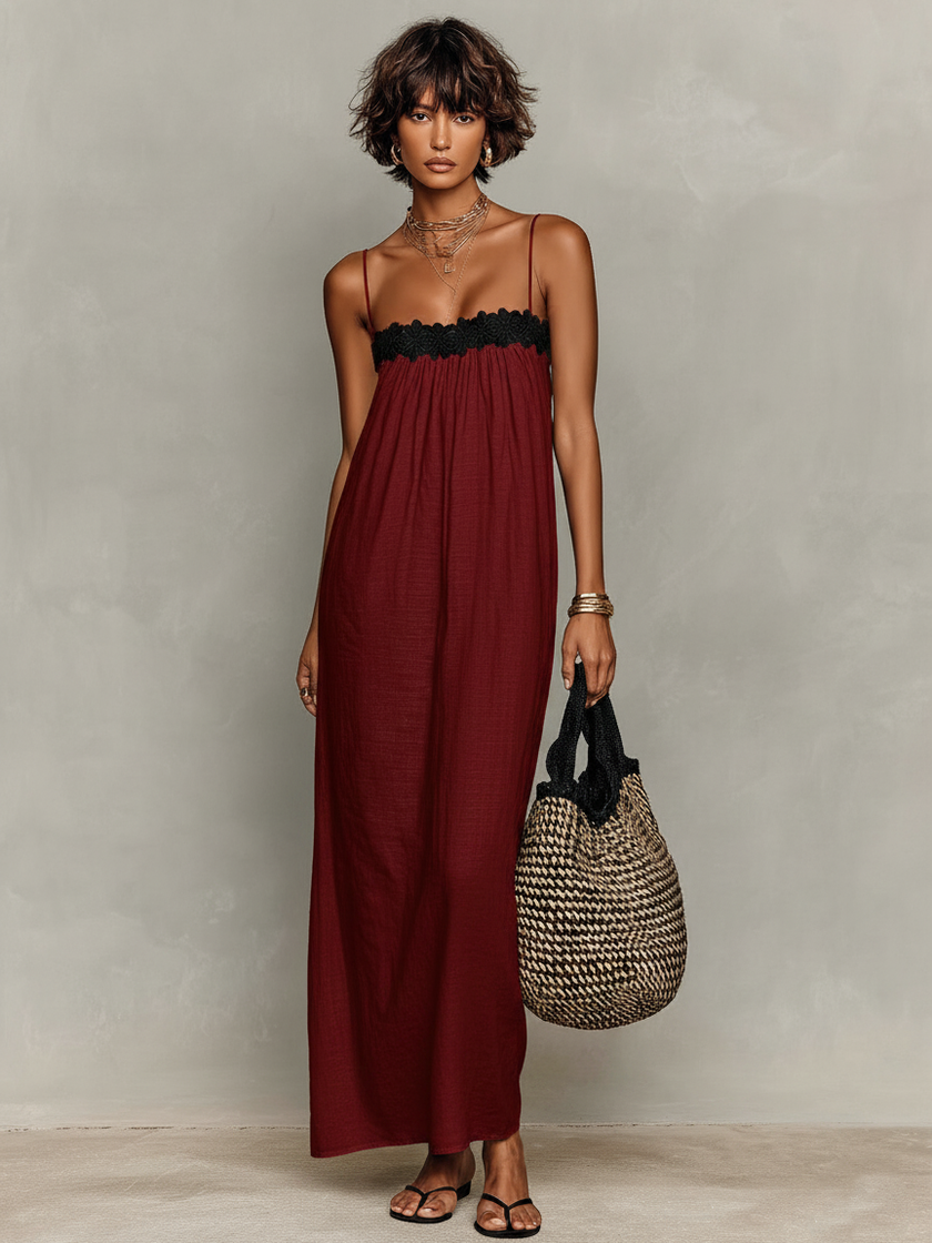 FJØRNA linen strapless maxi dress for evening wear, flowing fabric, elegant design, shown on a model.