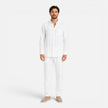 FJØRNA men's summer linen set with breathable, lightweight two-piece design featuring collar and button details.