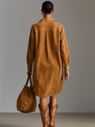 Red suede V-neck midi dress for women by FJØRNA, featuring a stylish V-neckline and elegant midi length.