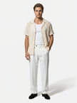 Man wearing FJØRNA straight fit tailored men's trousers, classic and versatile for everyday wear.