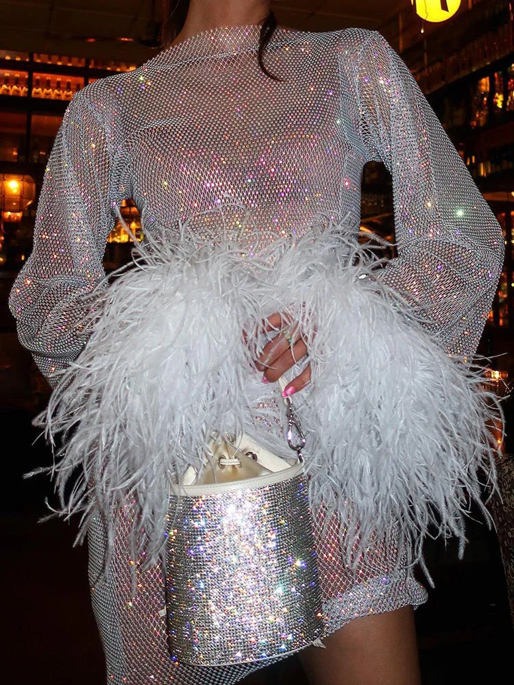 FJØRNA sequin feather mini dress with long sleeves, sheer details, fitted silhouette, and feather cuffs for women’s cocktail parties