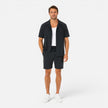 Men's lightweight summer set by FJØRNA featuring a textured shirt and matching shorts for casual warm-weather wear.