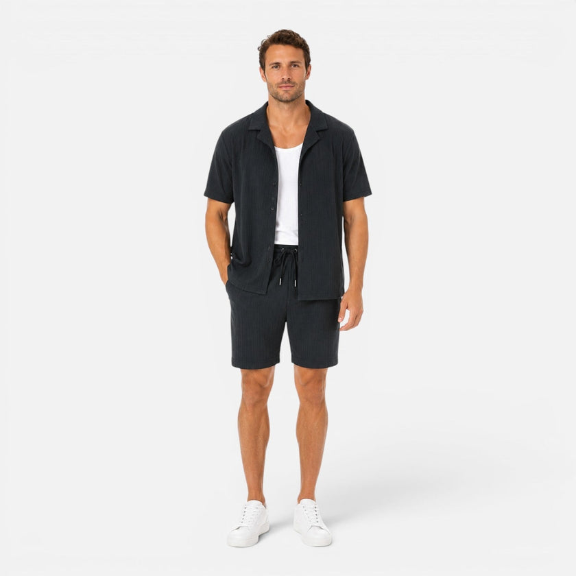 Men's lightweight summer set by FJØRNA featuring a textured shirt and matching shorts for casual warm-weather wear.