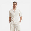 Men's corduroy shirt and shorts set by FJØRNA, casual summer outfit, featuring a relaxed fit and soft fabric in a stylish design.