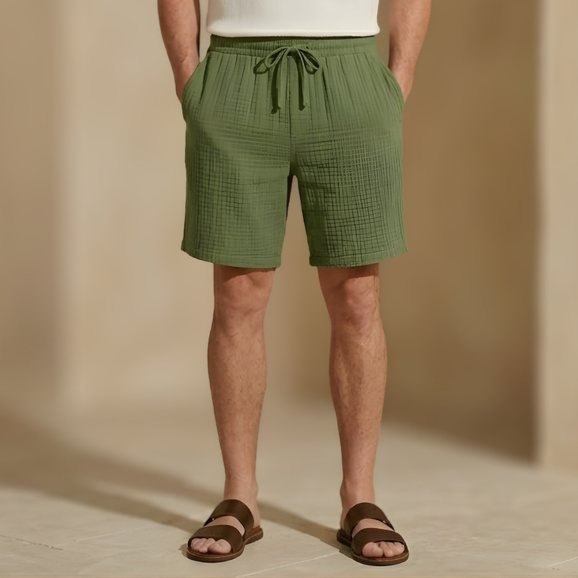 Men's textured relaxed-fit drawstring shorts by FJØRNA, casual summer shorts in lightweight fabric, styled for comfort.