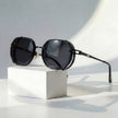 Men's geometric sunglasses with metal frame and gradient lenses by FJØRNA, showcasing stylish design and modern eyewear features.