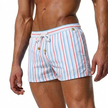 Men's striped swim shorts by FJØRNA with drawstring waist and quick-dry fabric, suitable for beach or pool activities.