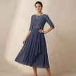 Model wearing FJØRNA elegant midi bodycon chiffon dress, showcasing a sophisticated women's dress with a fitted silhouette.