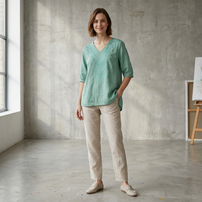 FJØRNA women's summer floral V-neck linen blouse with slit, worn by a model, perfect for warm-weather casual wear.