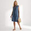 Model wearing FJØRNA women's summer two-piece pleated co-ord set, lightweight matching top and skirt ensemble.