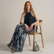 FJØRNA women's two-piece co-ord set with printed wide-leg pants and halter neck top, modeled on a woman showcasing stylish fashion.