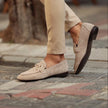 Beige men's suede loafers with horsebit detail and almond toe from FJØRNA, showcasing the stylish slip-on design.