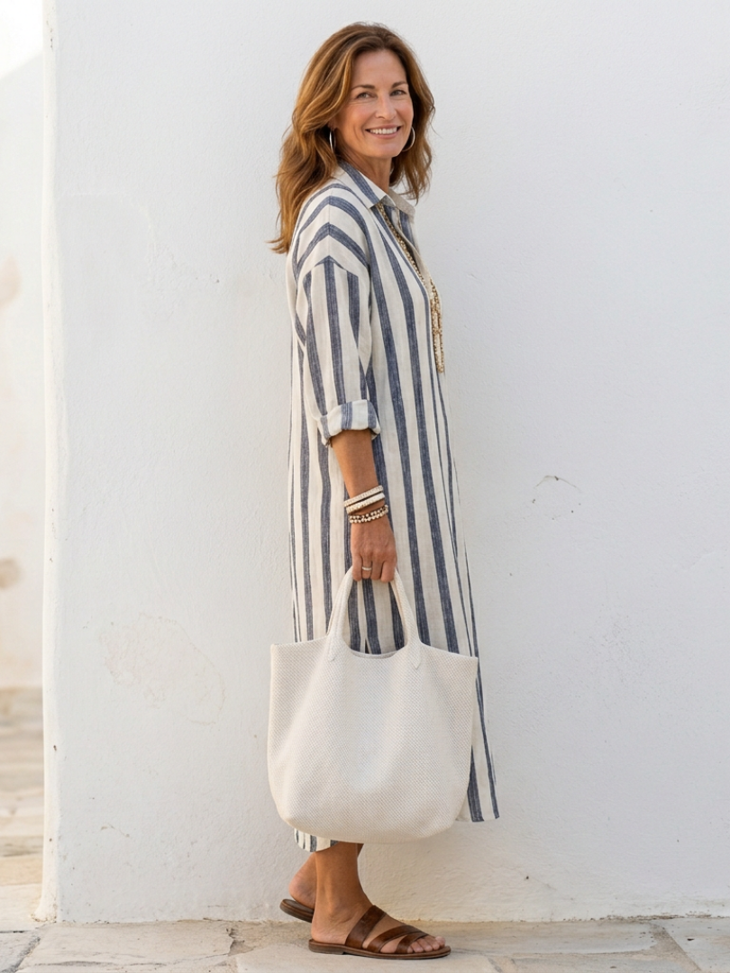 FJØRNA women's summer striped midi dress with long sleeves, flowing fabric, and casual style for warm weather.