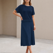 Navy blue knit two-piece cropped co-ord set for women by FJØRNA, featuring a fitted crop top and matching high-waisted pants.