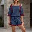 Navy blue women's summer two-piece co-ord set with drawstring off-shoulder top and matching shorts by FJØRNA.