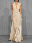 FJØRNA nude satin evening dress with elegant draping, sleeveless design, and fitted silhouette for formal occasions.