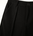 Women's wool tapered trousers by FJØRNA, made from Merino wool, featuring a comfortable, stylish tapered fit in neutral color.